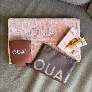 OUAI Travel Pouch with travel size products, towel and coozie